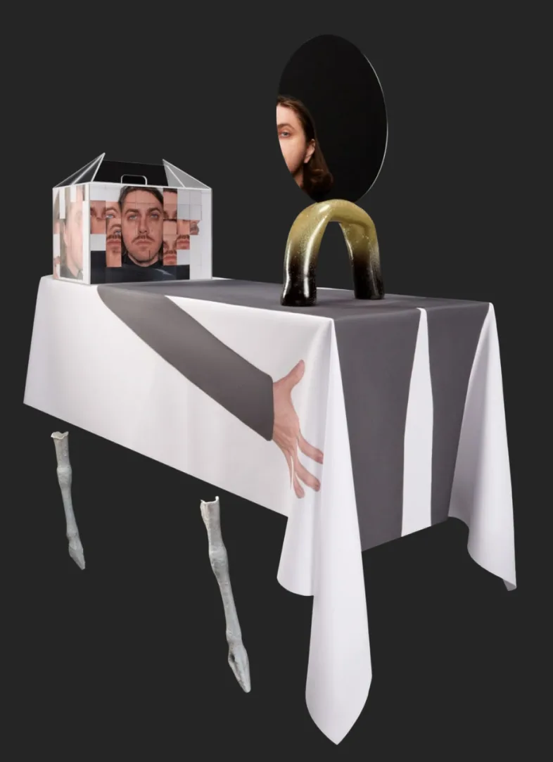 Box sculpture on a draped table