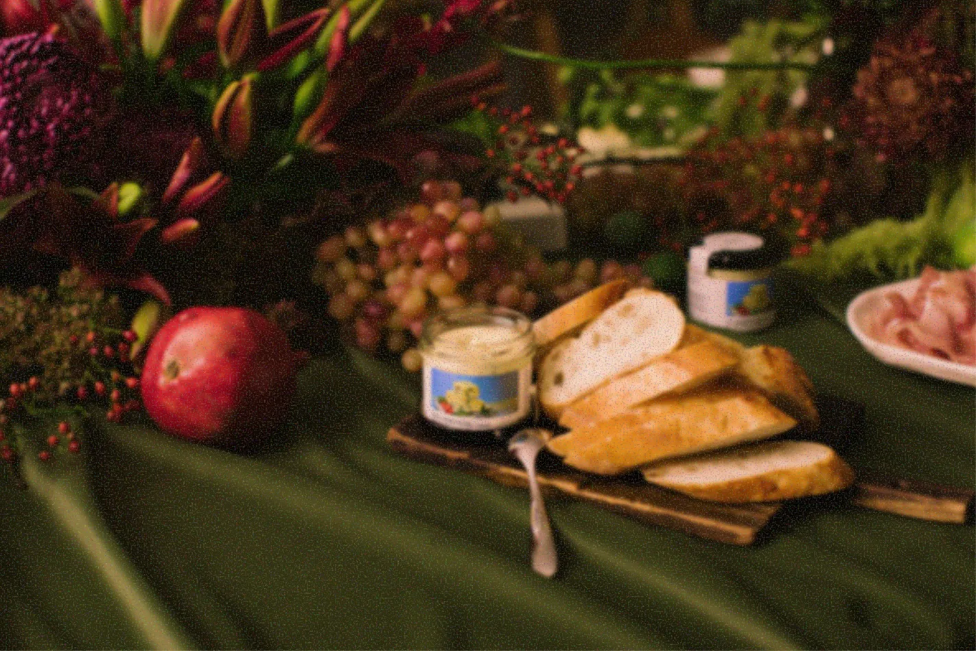 Still-life dinner table with bread and fruit